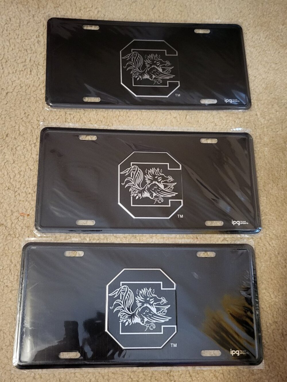 Three Carolina Gamecock Car Tags